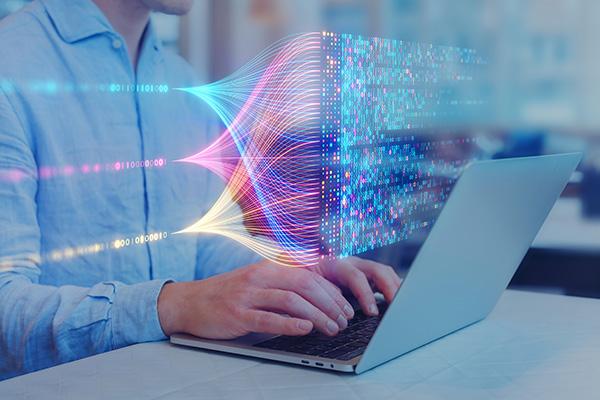 Student in Computer Science Creating Coding String on a Laptop